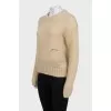 Translucent jumper with embroidered logo