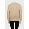 Translucent jumper with embroidered logo