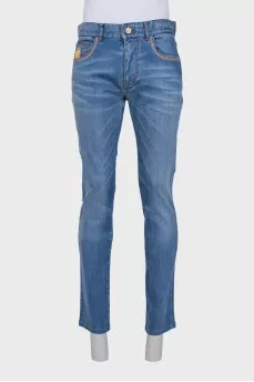 Men's blue jeans with embroidery on the pocket