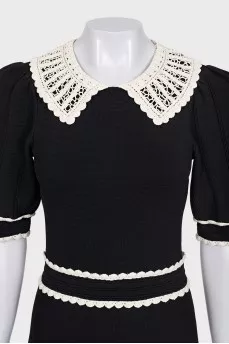 Black fitted dress with lace trim