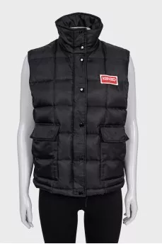 Black vest with logo patch
