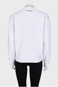 White sweatshirt with a patch