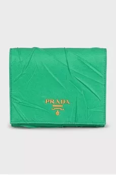 Textile wallet with a button