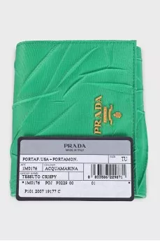 Textile wallet with a button