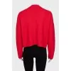 Red cardigan with silver buttons