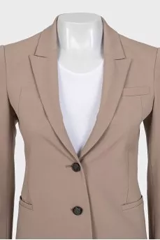 Beige jacket with branded buttons