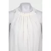 White pleated sleeveless blouse