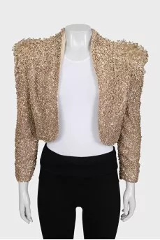 A cropped jacket decorated with crystals and sequins