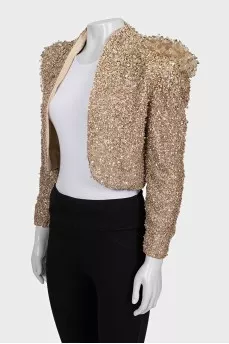 A cropped jacket decorated with crystals and sequins