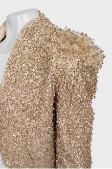 A cropped jacket decorated with crystals and sequins