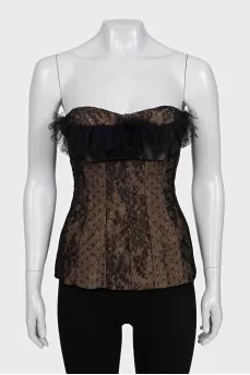 Lace corset top decorated with a bow
