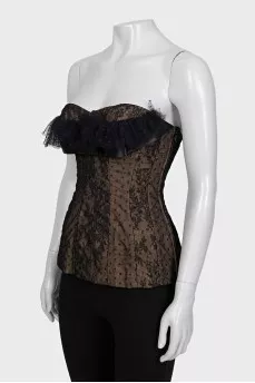 Lace corset top decorated with a bow