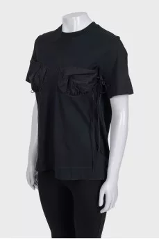 Black t-shirt with accent pockets and tag