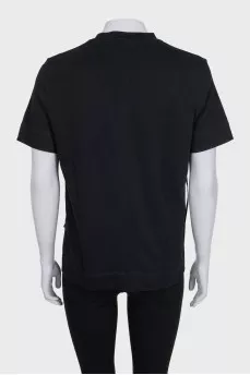 Black t-shirt with accent pockets and tag