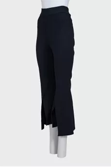 Blue flared trousers with slits in the legs