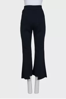 Blue flared trousers with slits in the legs