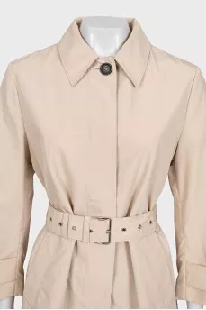 Beige fitted trench coat with belt
