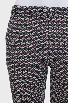 Tapered black trousers with a print