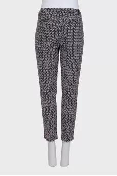 Tapered black trousers with a print