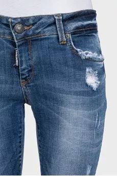 Blue skinny jeans with a distressed effect