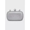 Clutch on a chain decorated with crystals