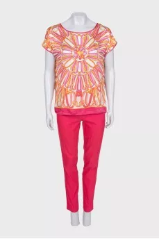 Pink suit with a silk blouse