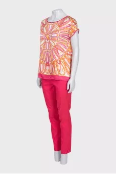 Pink suit with a silk blouse