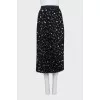 Black suit with a pleated skirt with a tag