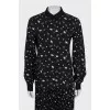 Black suit with a pleated skirt with a tag
