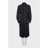 Black suit with a pleated skirt with a tag
