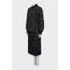 Black suit with a pleated skirt with a tag