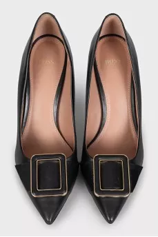 Black leather shoes with decor