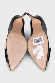 Black leather shoes with decor