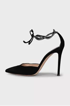 Black suede shoes decorated with rhinestones