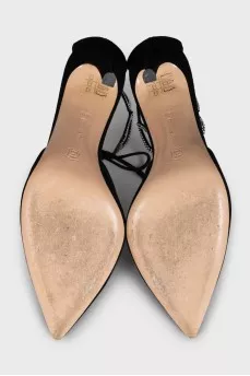 Black suede shoes decorated with rhinestones