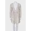 Dress with a cutout decorated with sequins
