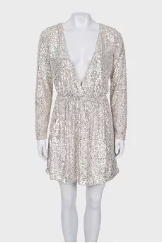 Dress with a cutout decorated with sequins