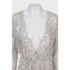 Dress with a cutout decorated with sequins