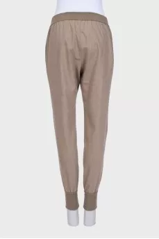 Brown tapered trousers with elastic waistband