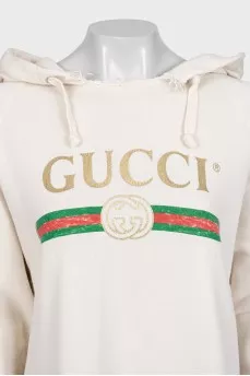 Hoodie with a ripped effect and embroidered details