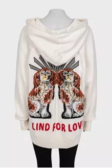 Hoodie with a ripped effect and embroidered details
