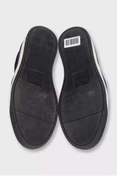 Men's suede slip-ons decorated with studs