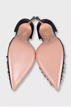 Black textile shoes with a decorated toe