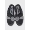 Men's black sneakers with logo