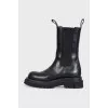 Black leather high boots