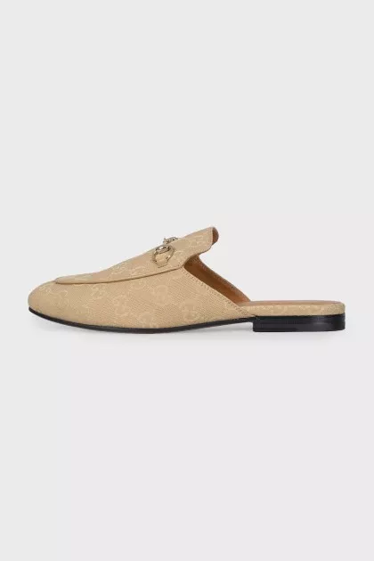 Textile clogs with a signature print and tag