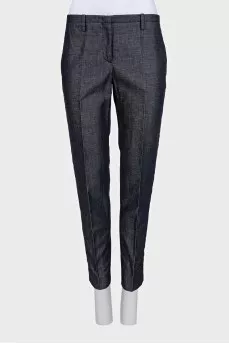 Blue trousers with silk inserts and tag