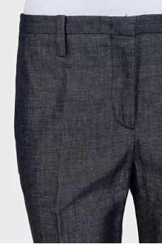 Blue trousers with silk inserts and tag