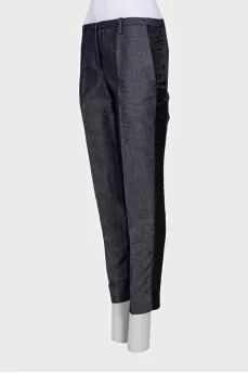 Blue trousers with silk inserts and tag