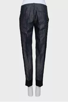 Blue trousers with silk inserts and tag